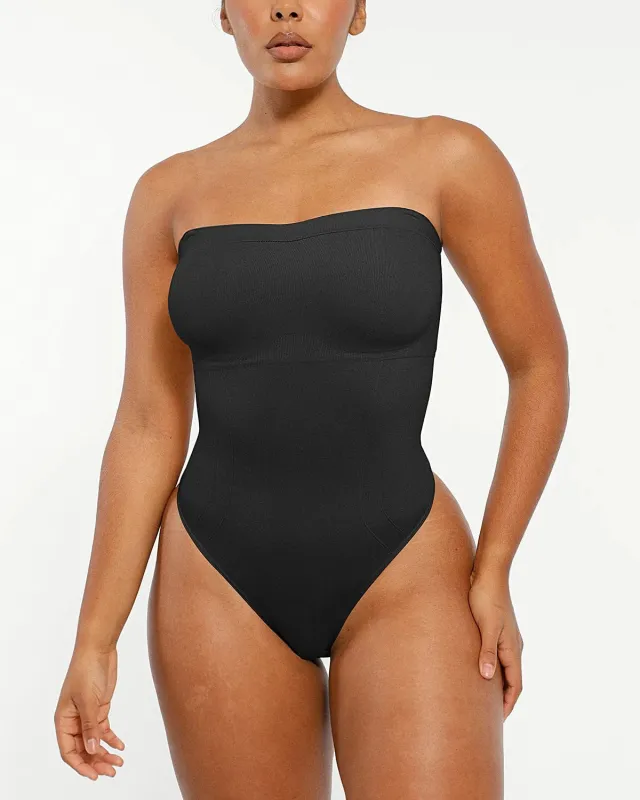 Bare Essentials™ Skin Flow™ Strapless Sculpt Thong Bodysuit sold by Shapellx