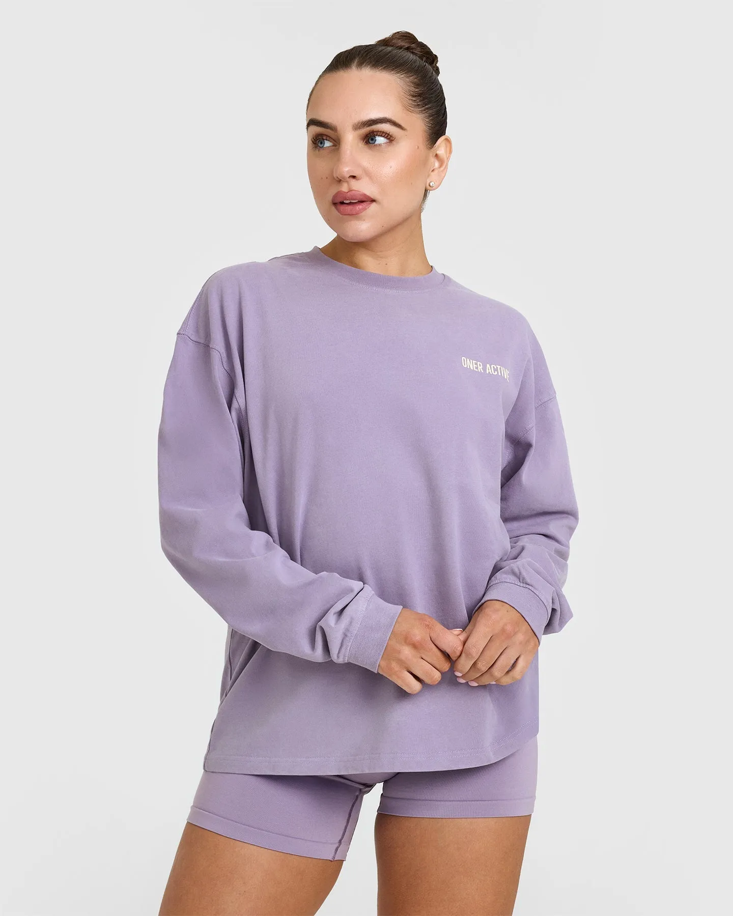 Oversized Graphic Washed Long Sleeve Top | Soft Purple sold by Oner Active