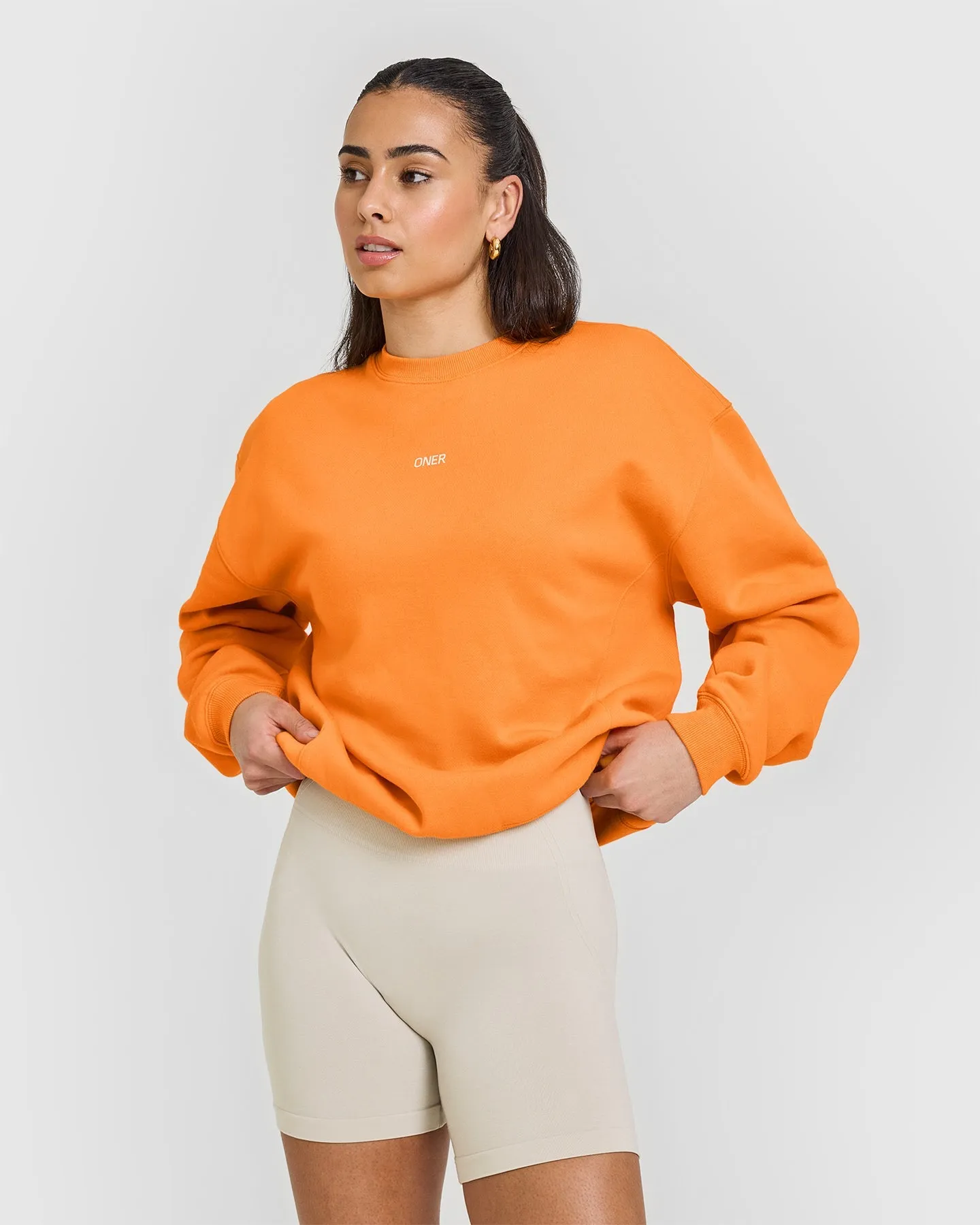 Foundations Raising the Bar Crew Neck Sweatshirt | Apricot Orange sold by Oner Active