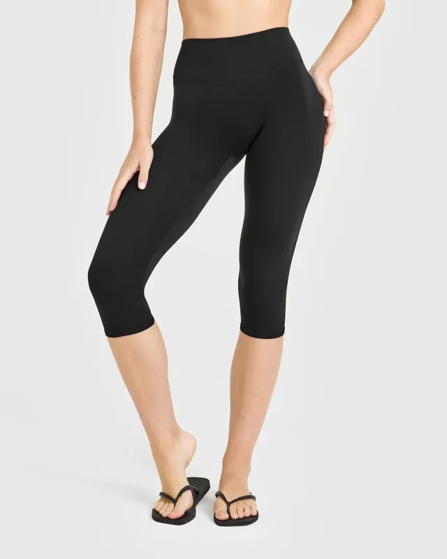 SoftMotion™ High Waisted Capri Leggings | Black sold by Oner Active