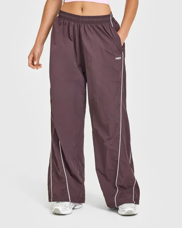 Oversized Piped Woven Straight Leg Track Bottoms | Deep Umber Brown sold by Oner Active