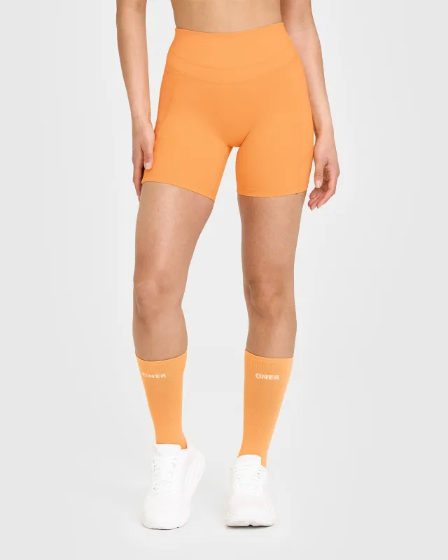 Unified High Waisted Pocket Shorts 6" | Powdered Orange sold by Oner Active