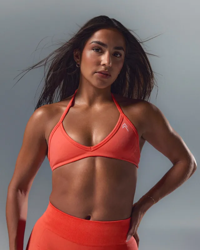 EnhanceLift™ Seamless Minimal Halter Neck Bralette with White Logo | Charged Coral sold by Oner Active