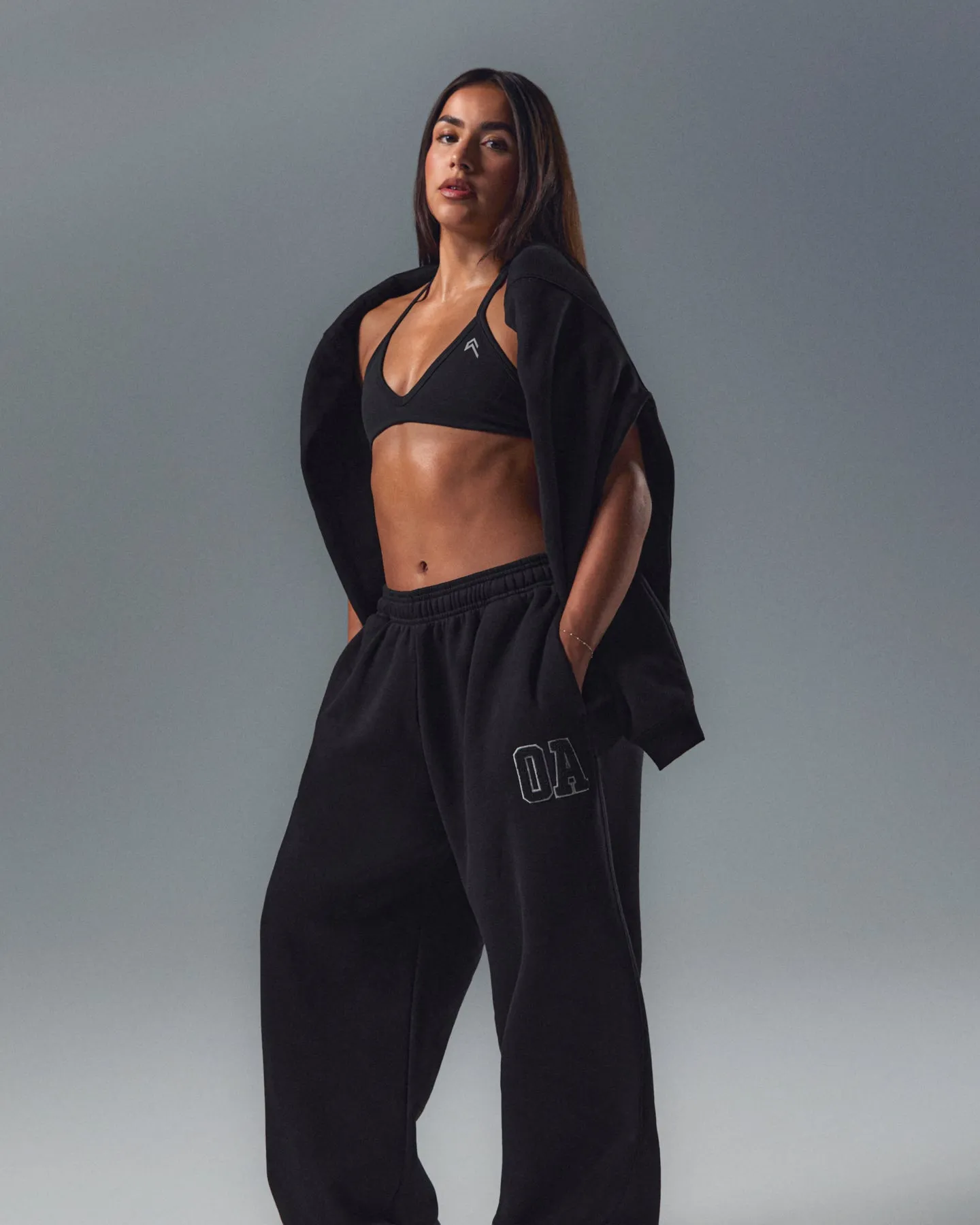 EnhanceLift™ Seamless Minimal Halter Neck Bralette with White Logo | Black sold by Oner Active