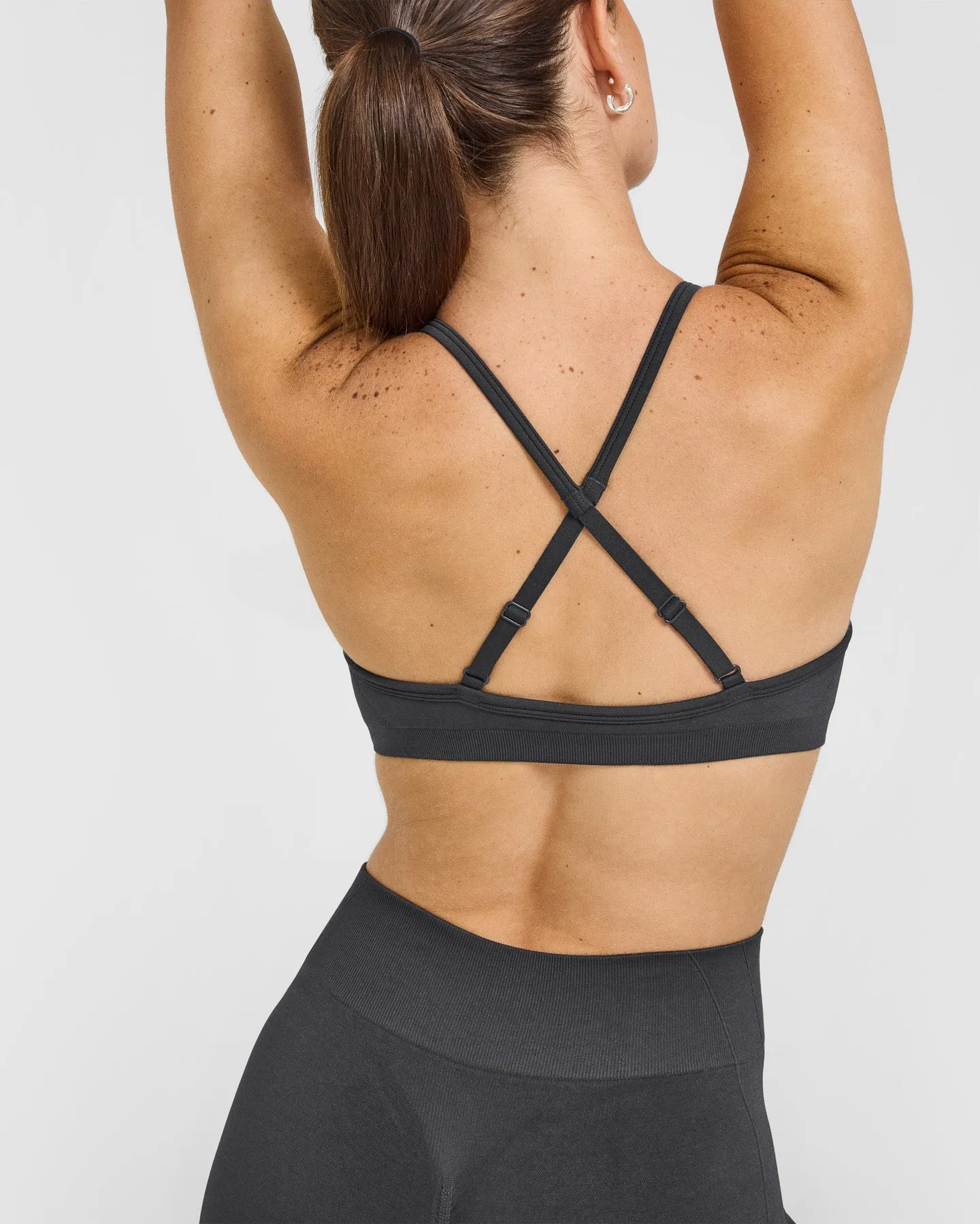 EnhanceLift™ Seamless Strappy Sports Bra with White Logo | Coal sold by Oner Active product image thumbnail 4