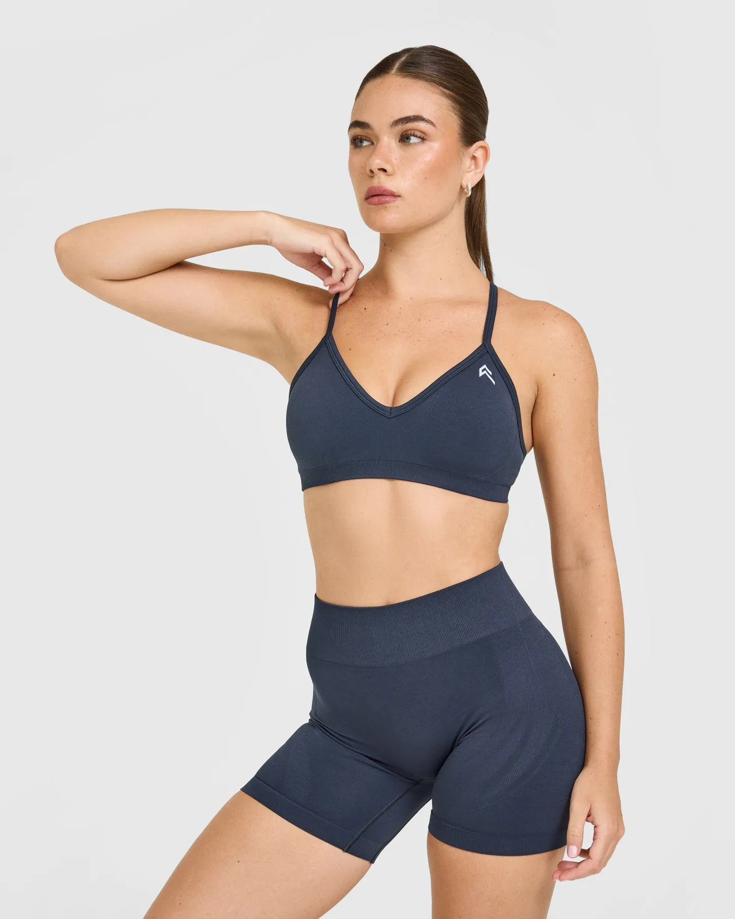 EnhanceLift™ Seamless Strappy Sports Bra with White Logo | True Blue sold by Oner Active