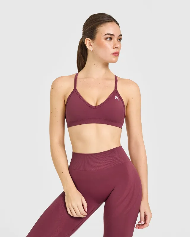 EnhanceLift™ Seamless Strappy Sports Bra with White Logo | Burnt Maroon sold by Oner Active