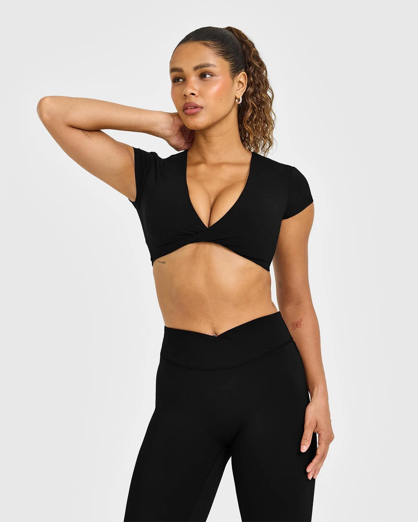 Unified Twist Front Short Sleeve Crop Top White Logo | Black sold by Oner Active