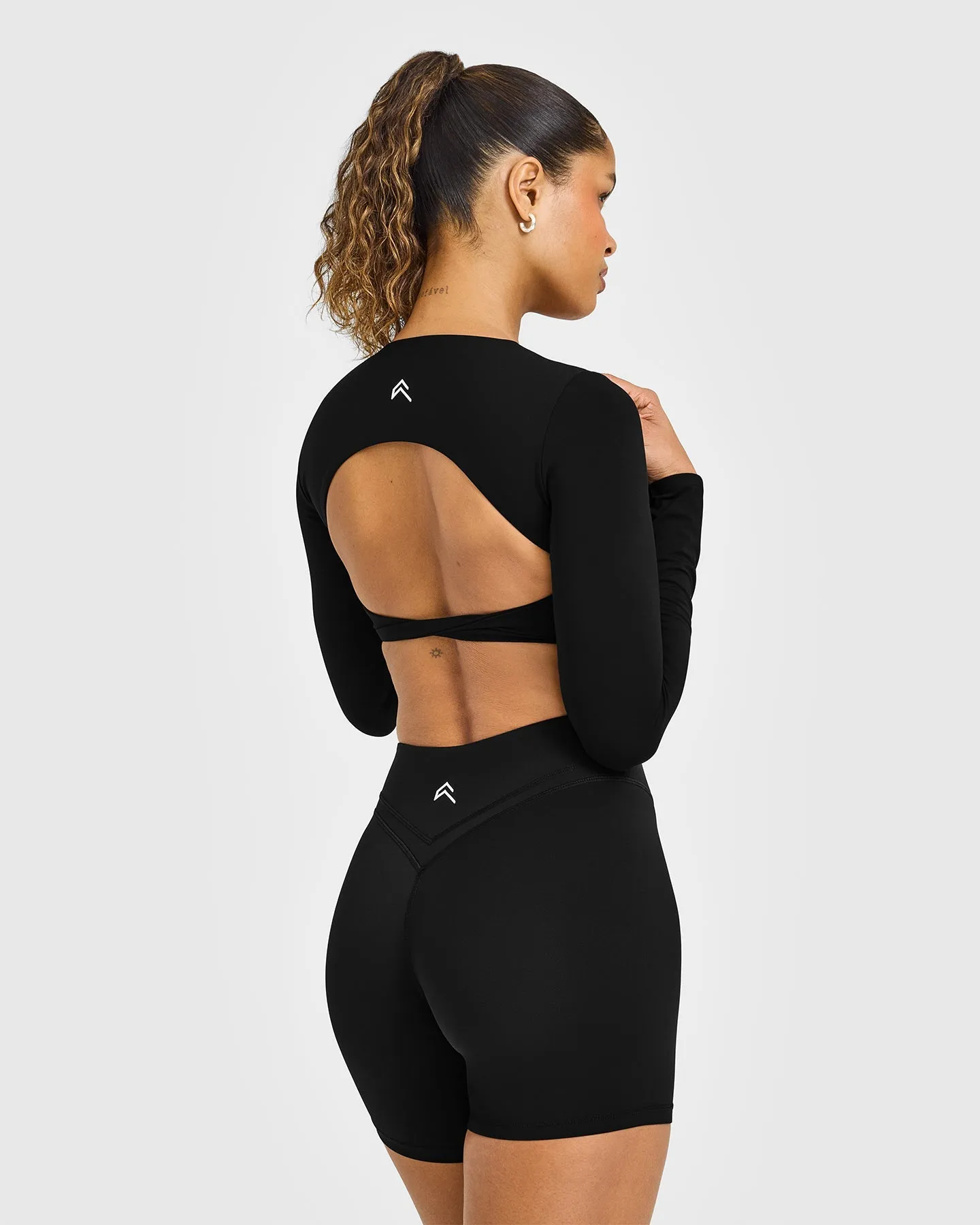 Unified Twist Front Long Sleeve Crop Top White Logo | Black sold by Oner Active product image thumbnail 2