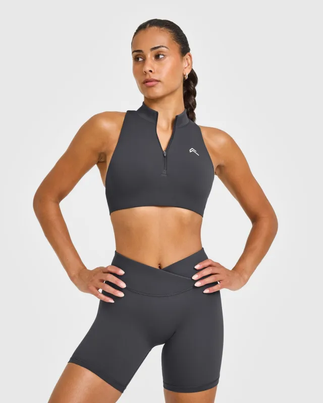 EasyLift™ Zip High Neck Sports Bra with White Logo | Coal sold by Oner Active