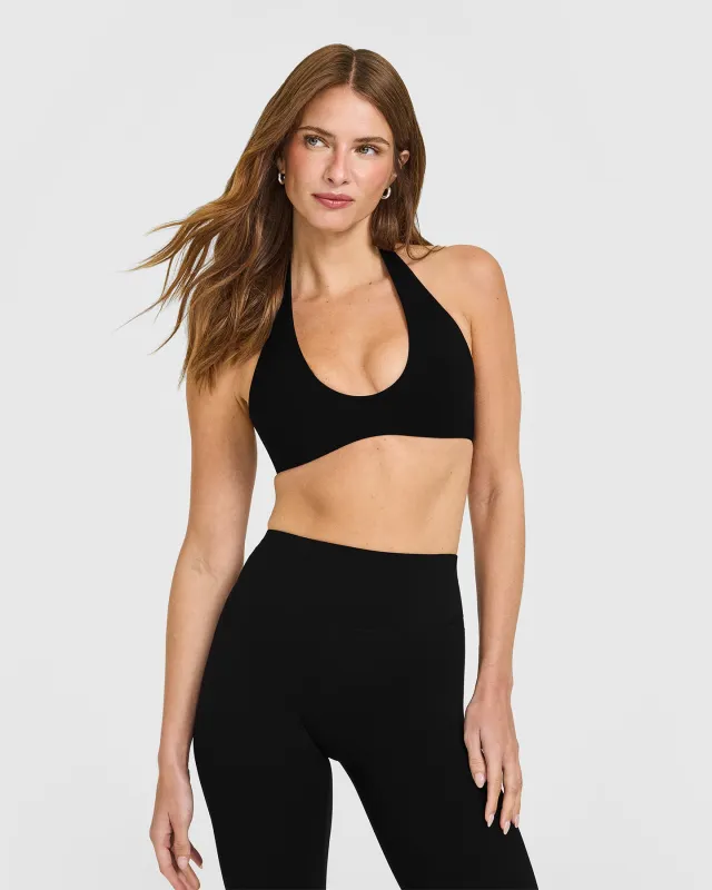 SoftMotion™ Minimal Halter Neck Bralette with White Logo | Black sold by Oner Active