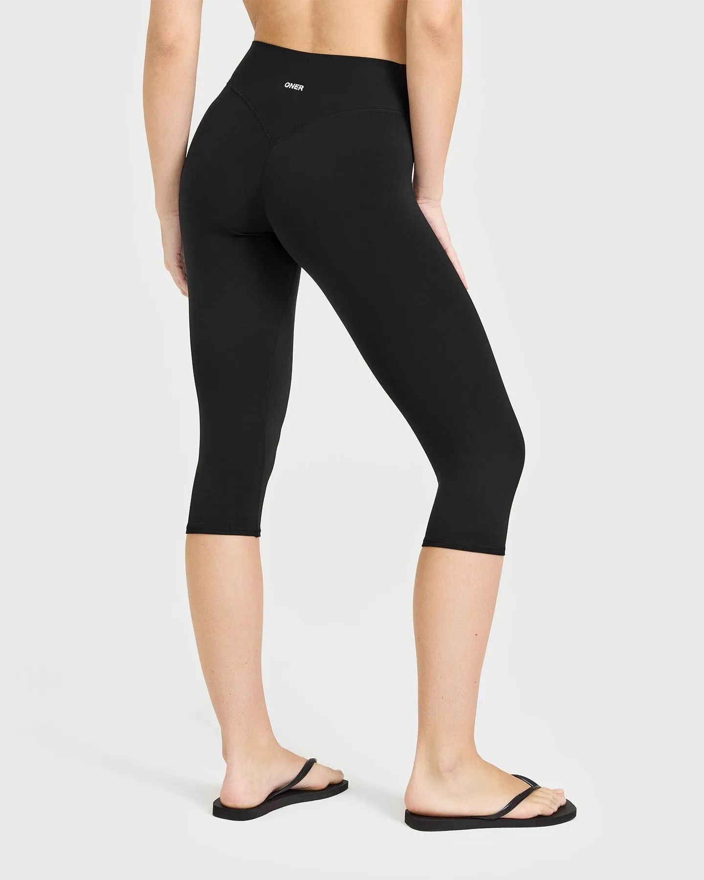 SoftMotion™ High Waisted Capri Leggings with White Logo | Black sold by Oner Active product image thumbnail 2