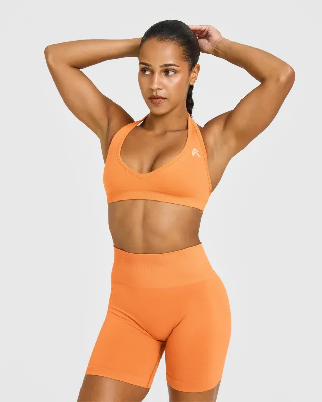 Effortless Seamless Halter Neck Sports Bra with White Logo | Apricot Orange sold by Oner Active