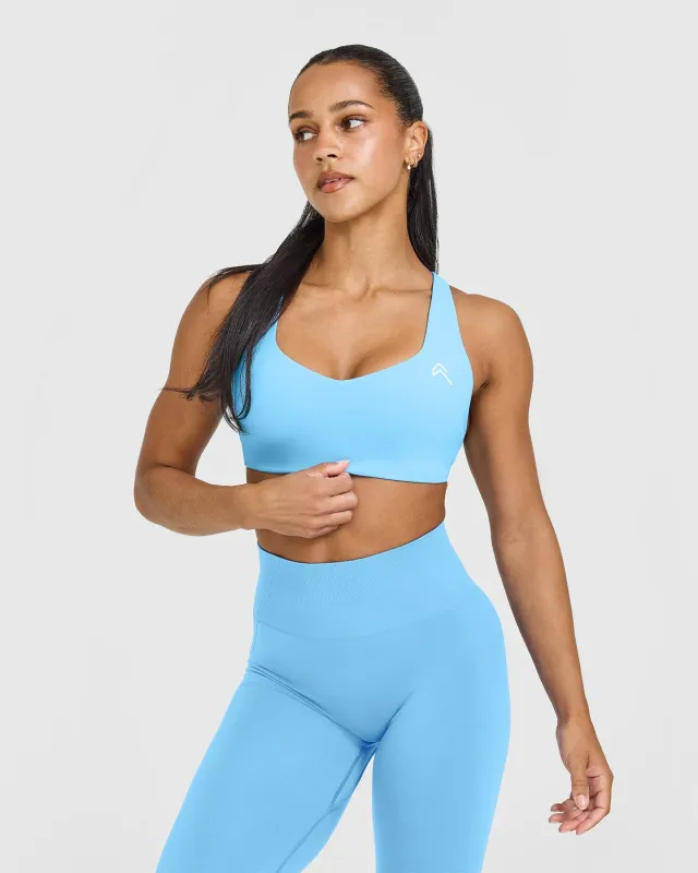 EasyLift™ Cross Back Sports Bra with White Logo | Arctic Blue sold by Oner Active