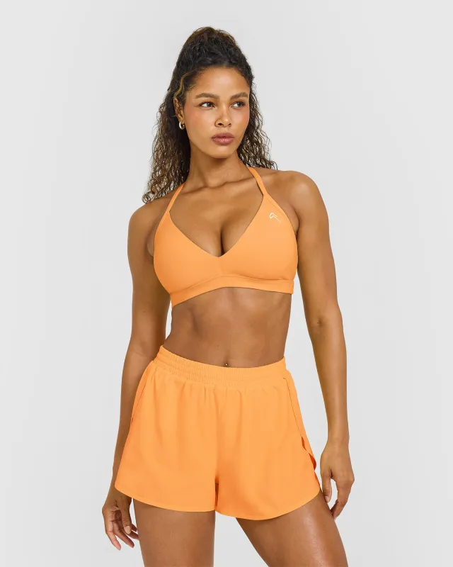 EasyLift™ Ultra Minimal V Neck Bralette with White Logo | Powdered Orange sold by Oner Active