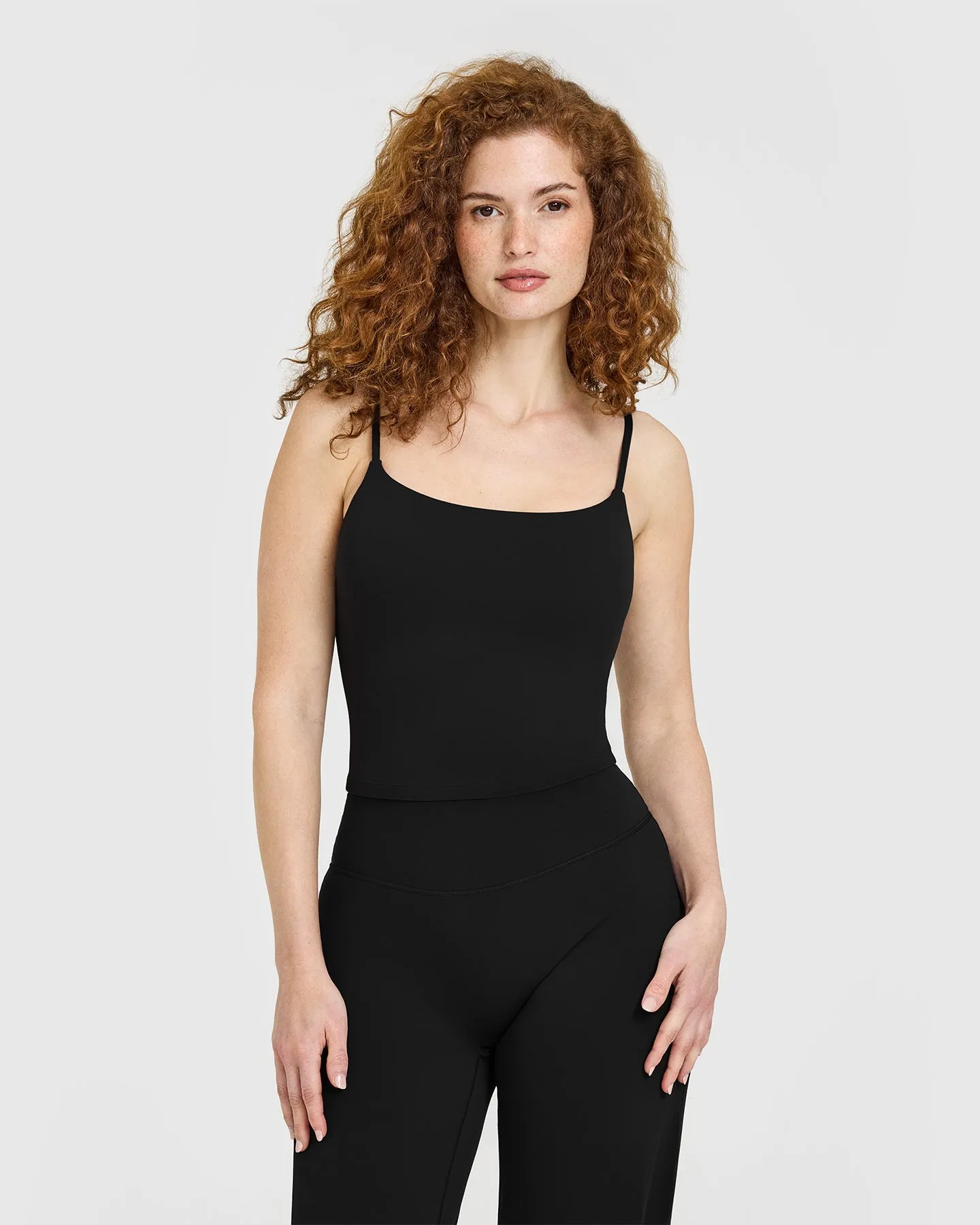 SoftMotion™ Strappy Mid Vest with Built in Bra Shelf with White Logo | Black sold by Oner Active