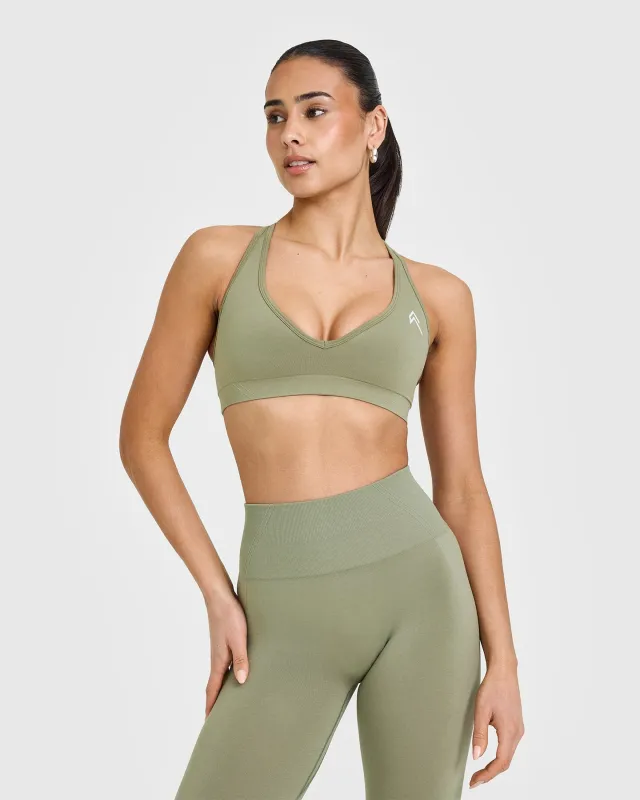 Effortless Seamless Racer Back Sports Bra with White Logo | Deep Sage Green sold by Oner Active
