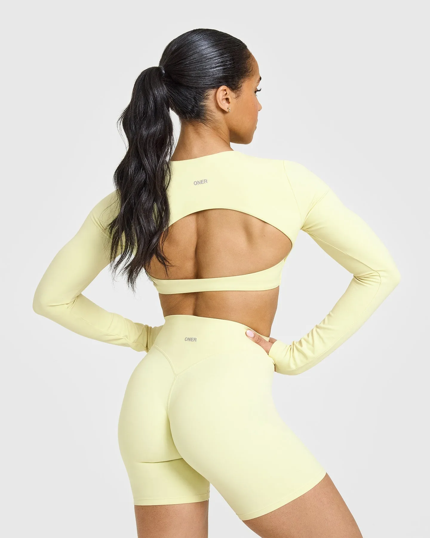 SoftMotion™ Long Sleeve Crop Top with White Logo | Pastel Yellow sold by Oner Active product image thumbnail 2