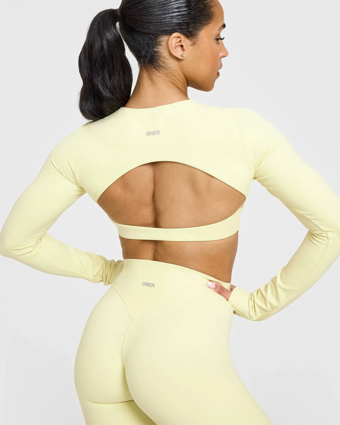SoftMotion™ Long Sleeve Crop Top with White Logo | Pastel Yellow sold by Oner Active product image thumbnail 4