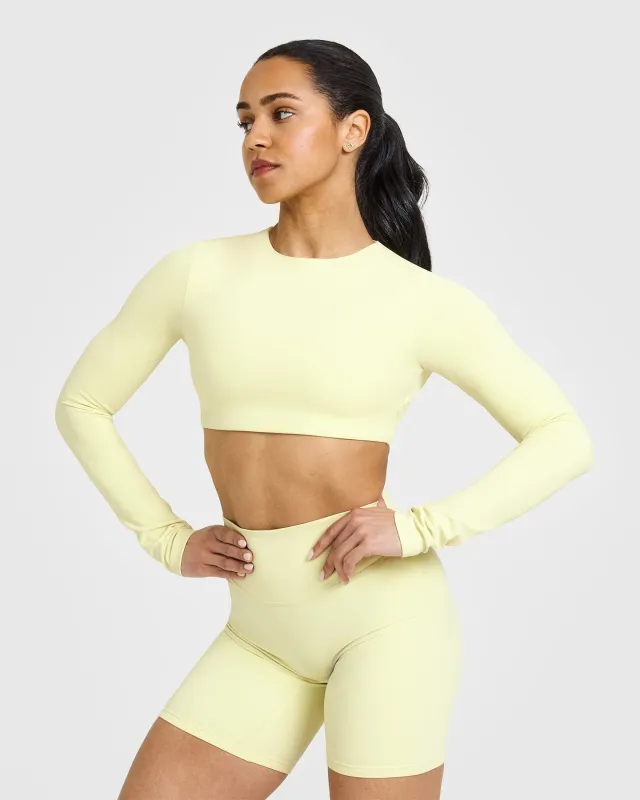 SoftMotion™ Long Sleeve Crop Top with White Logo | Pastel Yellow sold by Oner Active