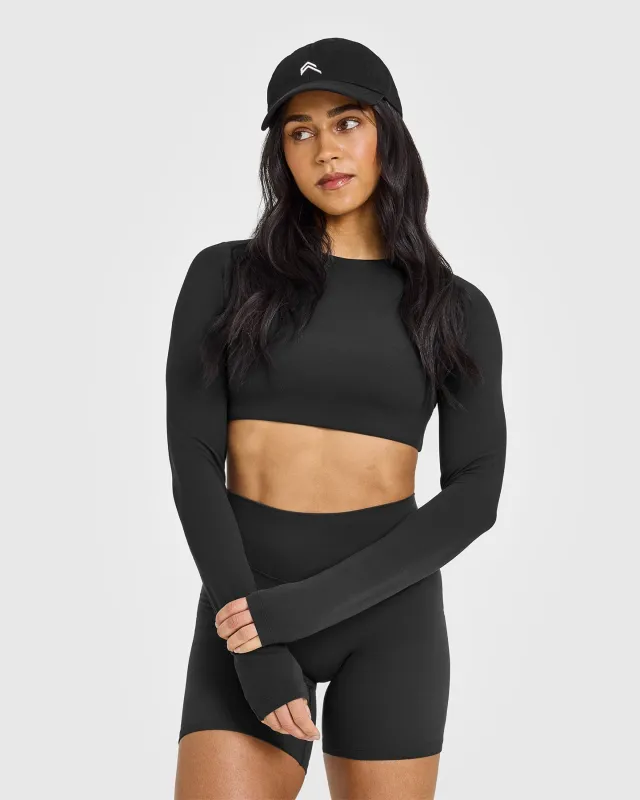 SoftMotion™ Long Sleeve Crop Top with White Logo | Soft Black sold by Oner Active
