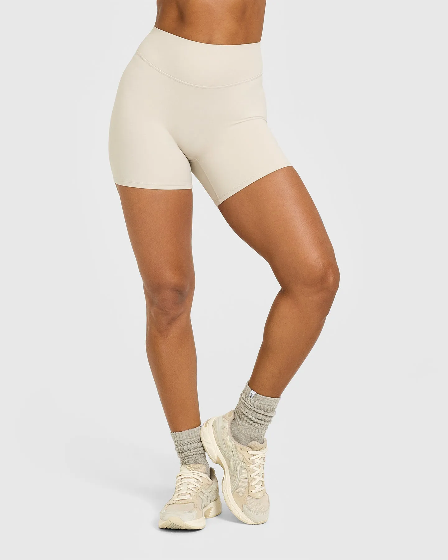 SoftMotion™ High Waisted Shorts 6" with White Logo | Sand sold by Oner Active