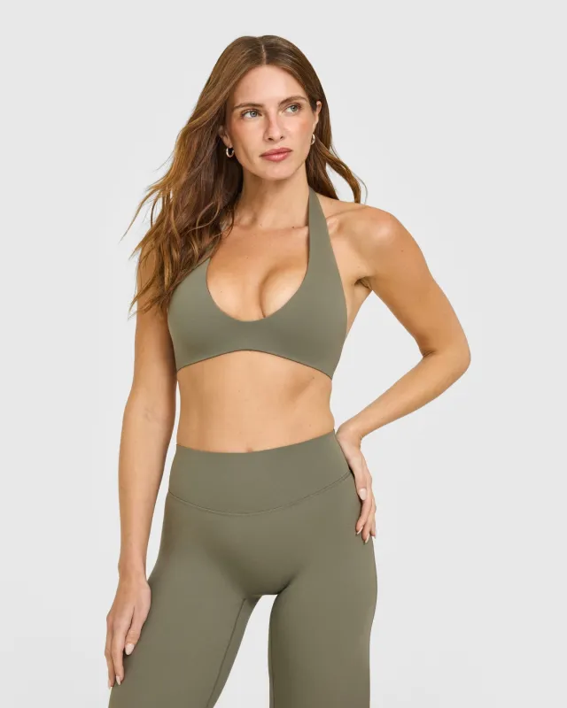 SoftMotion™ Minimal Halter Neck Bralette with White Logo | Alpine Green sold by Oner Active