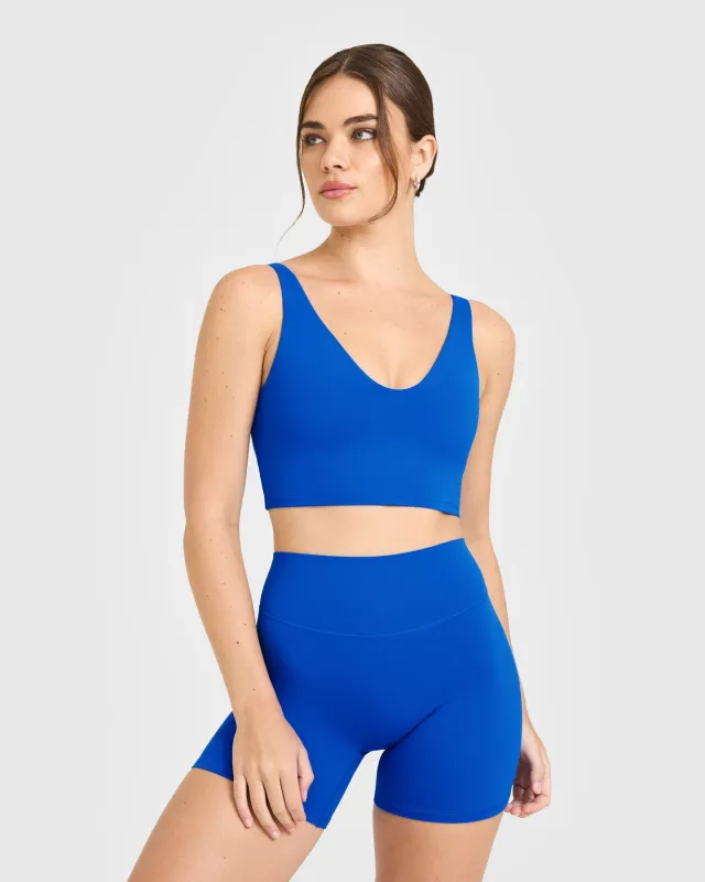 SoftMotion™ Longline Sports Bra with White Logo | Light Cobalt Blue sold by Oner Active