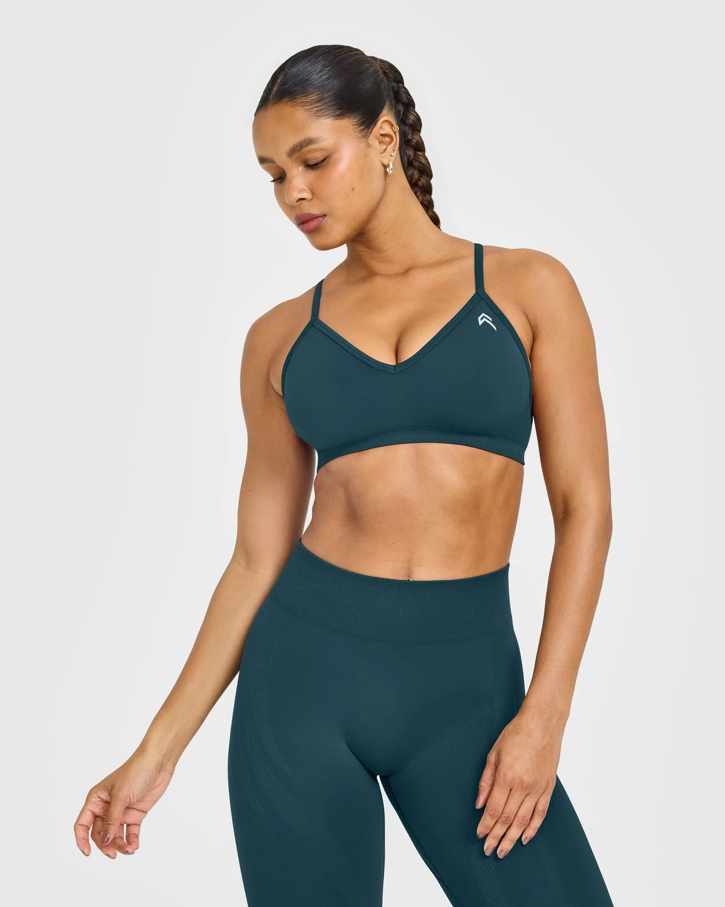 EnhanceLift™ Seamless Strappy Sports Bra with White Logo | Washed Oil Blue sold by Oner Active