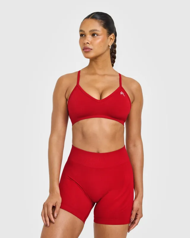 EnhanceLift™ Seamless Strappy Sports Bra with White Logo | Light Toasted Red sold by Oner Active