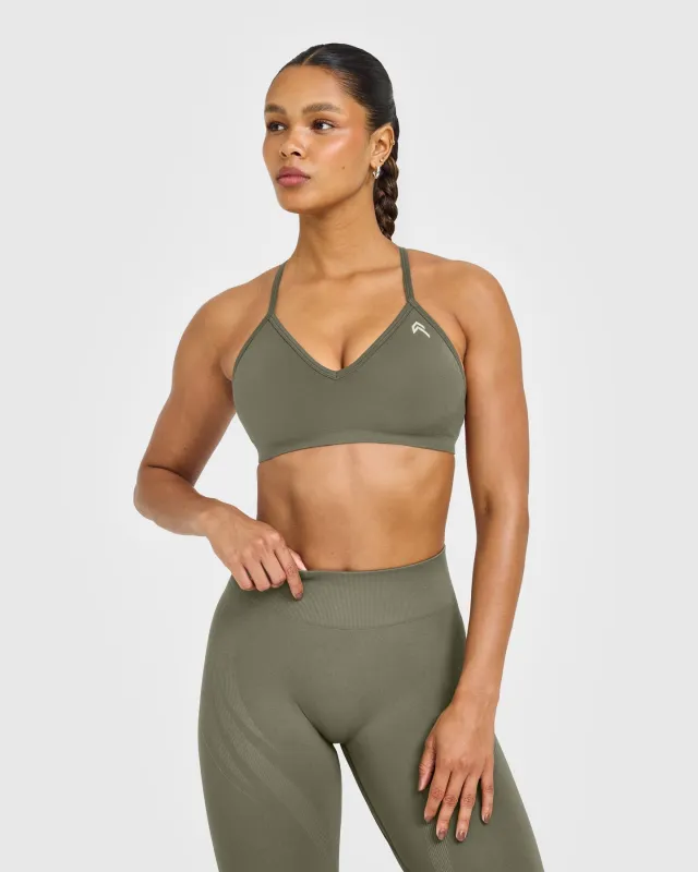 EnhanceLift™ Seamless Strappy Sports Bra with White Logo | Alpine Green sold by Oner Active