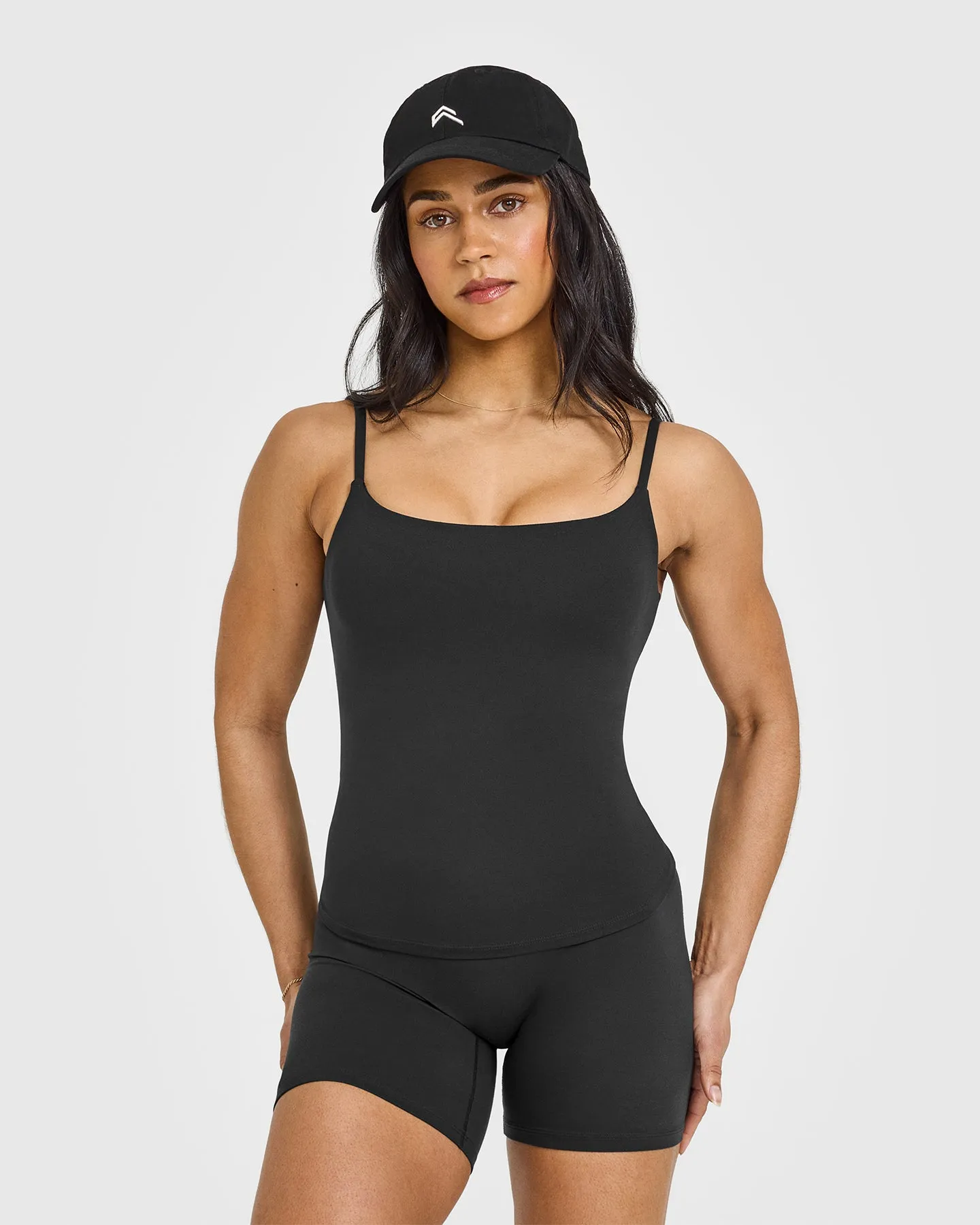 SoftMotion™ Strappy Vest with Built in Bra Shelf with White Logo | Soft Black sold by Oner Active