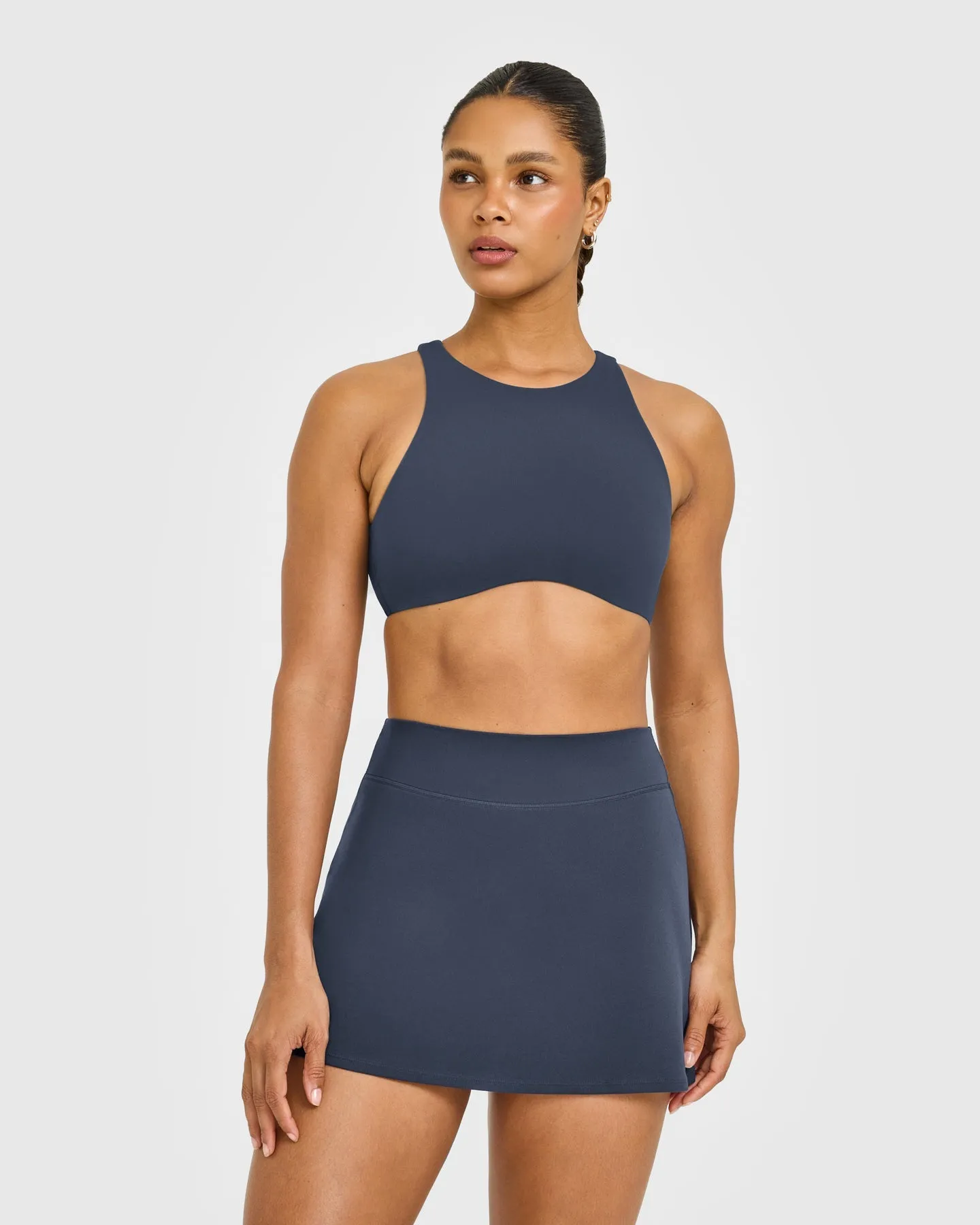 SoftMotion™ High Neck Sports Bra with White Logo | True Blue sold by Oner Active