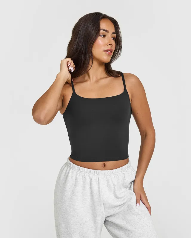 SoftMotion™ Strappy Mid Vest with Built in Bra Shelf with White Logo | Soft Black sold by Oner Active