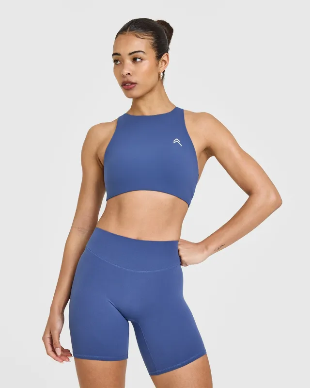 EasyLift™ High Neck Sports Bra with White Logo | Shadow Blue sold by Oner Active