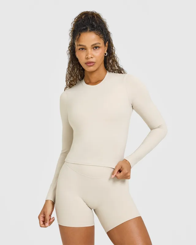 SoftMotion™ Long Sleeve Mid Top with White Logo | Sand sold by Oner Active