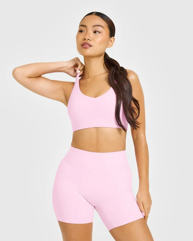 SoftMotion™ Sports Bra with White Logo | Chalk Pink sold by Oner Active