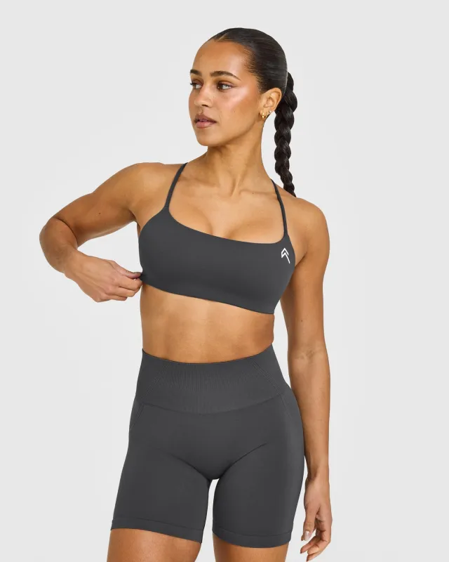 EasyLift™ Strappy Sports Bra with White Logo | Coal sold by Oner Active