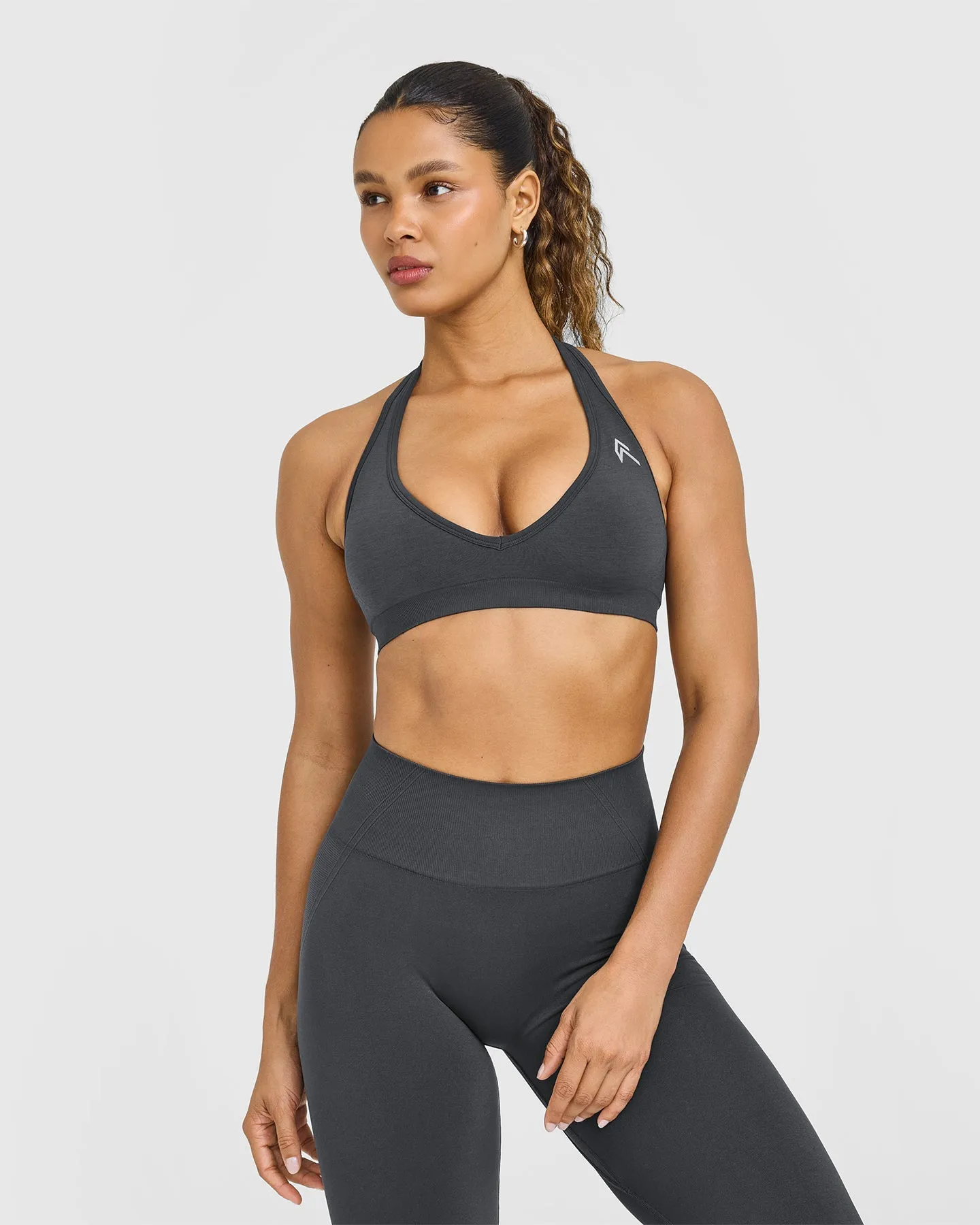 EffortlessLift™ Seamless Halter Neck Sports Bra with White Logo | Coal sold by Oner Active