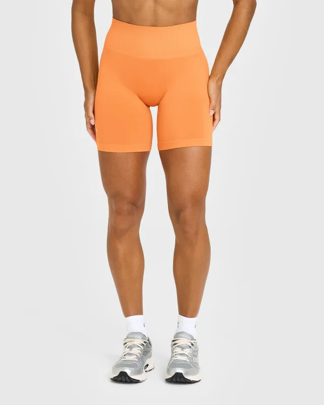 EffortlessLift™ Seamless Shorts with White Logo | Apricot Orange sold by Oner Active