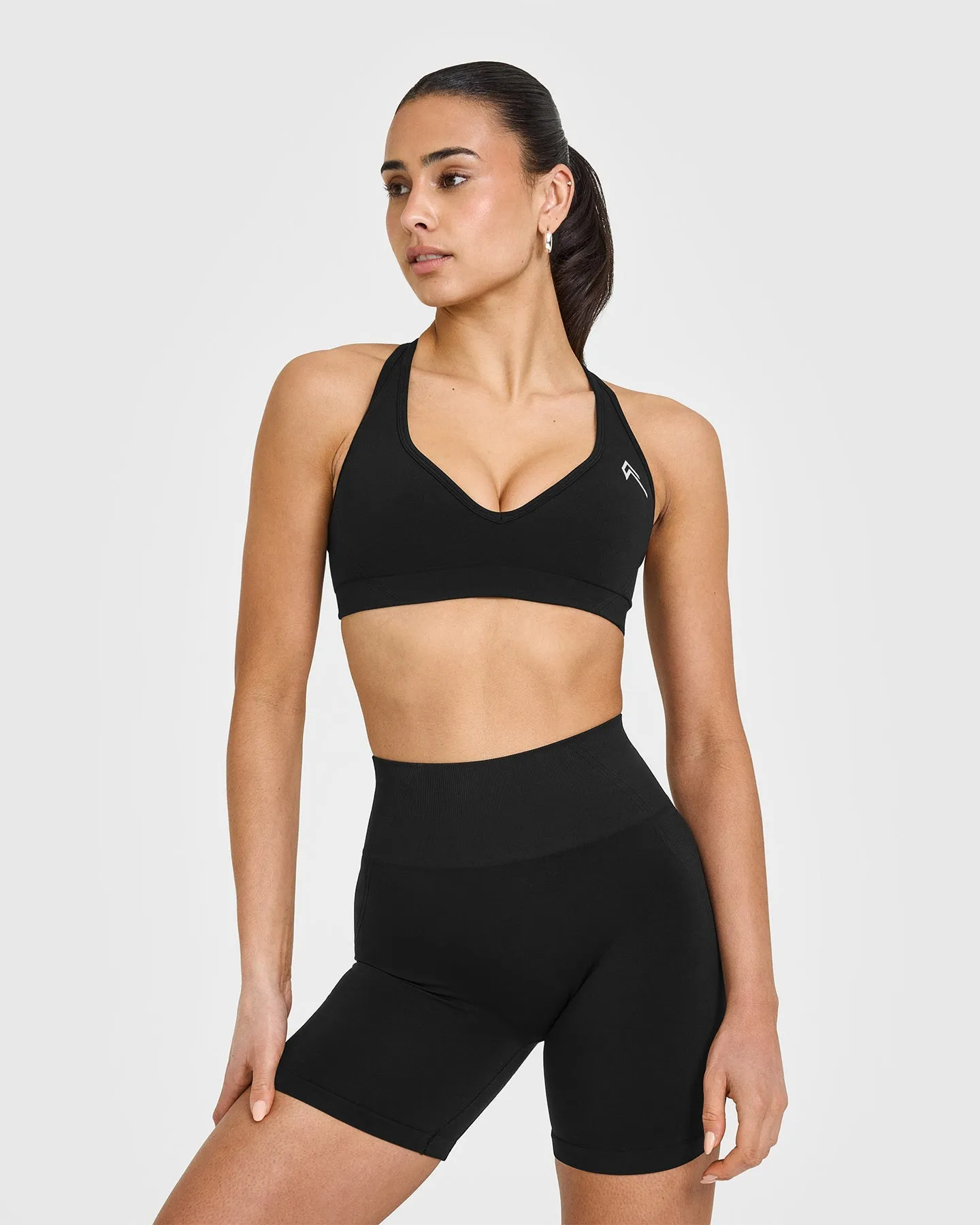 EffortlessLift™ Seamless Racer Back Sports Bra with White Logo | Black sold by Oner Active