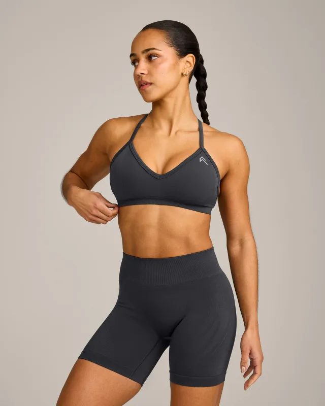 EnhanceLift™ Seamless Strappy Sports Bra with Grey Logo | Coal sold by Oner Active