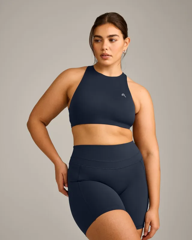 EasyLift™ High Neck Sports Bra with Grey Logo | True Blue sold by Oner Active