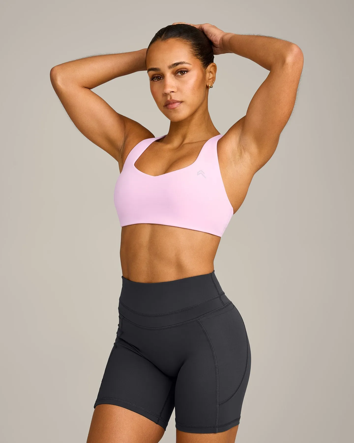 EasyLift™ Cross Back Sports Bra with Grey Logo | Chalk Pink sold by Oner Active