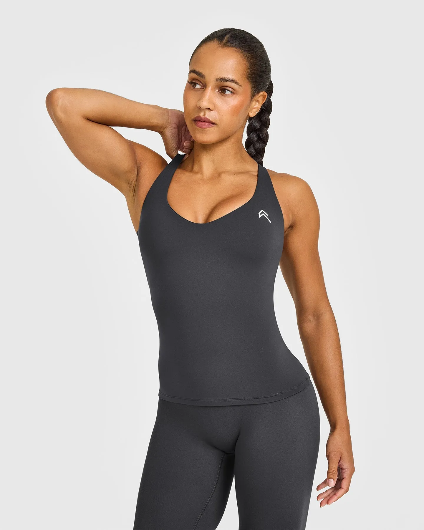 UnifiedMove™ V Neck Cross Back Vest White Logo | Coal sold by Oner Active