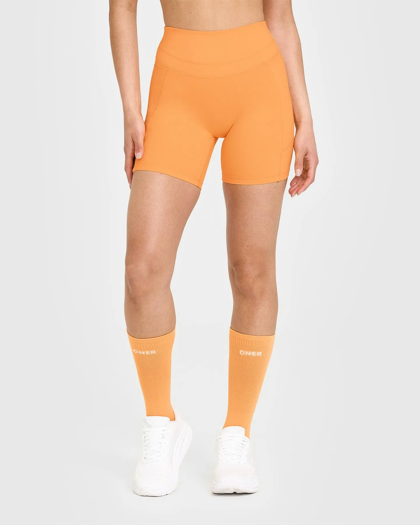 UnifiedMove™ High Waisted Pocket Shorts 6" | Powdered Orange sold by Oner Active