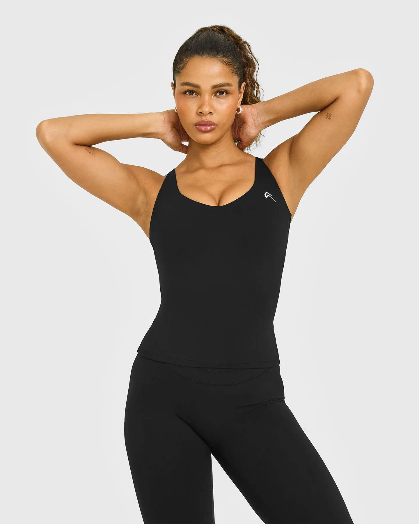 UnifiedMove V Neck Cross Back Vest White Logo | Black sold by Oner Active