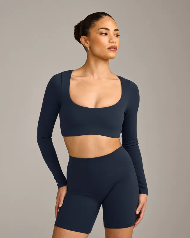 SoftMotion™ Scoop Neck Long Sleeve Crop Top with Built in Bra Shelf with Grey Logo | True Blue sold by Oner Active