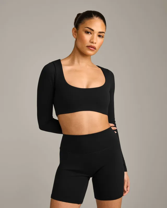 SoftMotionâ„¢ Scoop Neck Long Sleeve Crop Top with Built in Bra Shelf with Grey Logo | Black made by Oner Active