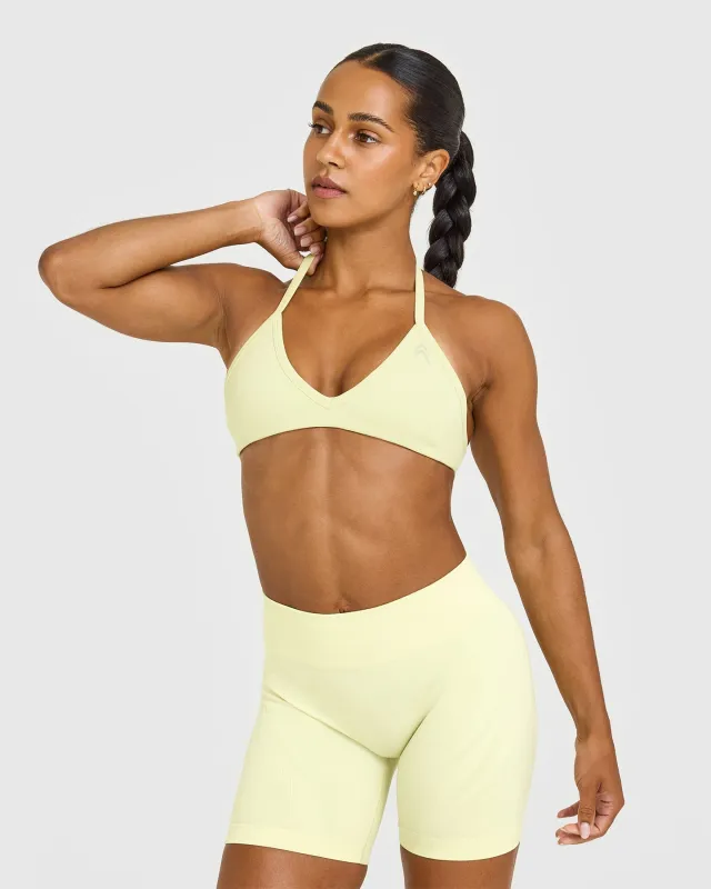 EnhanceLift™ Seamless Minimal Halter Neck Bralette with Grey Logo | Pastel Yellow made by Oner Active